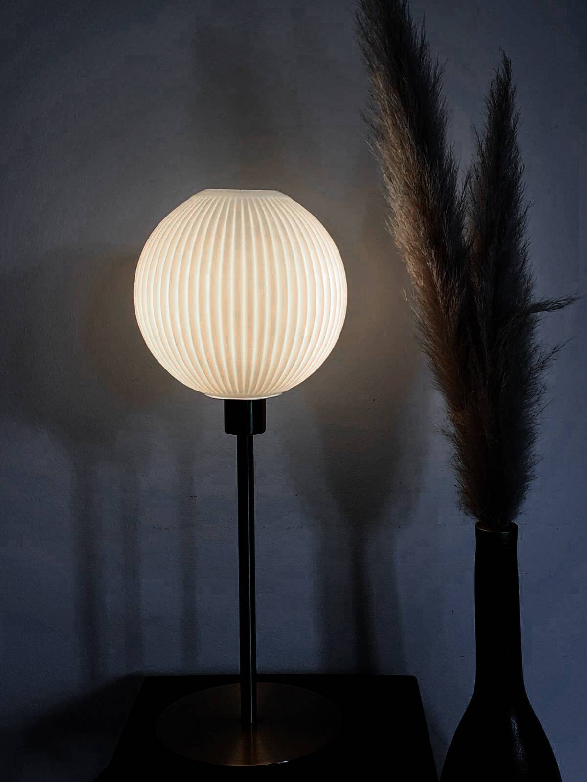 Table lamp with a lampshade from an old vintage pendant light in ribbed white glass and a pi
