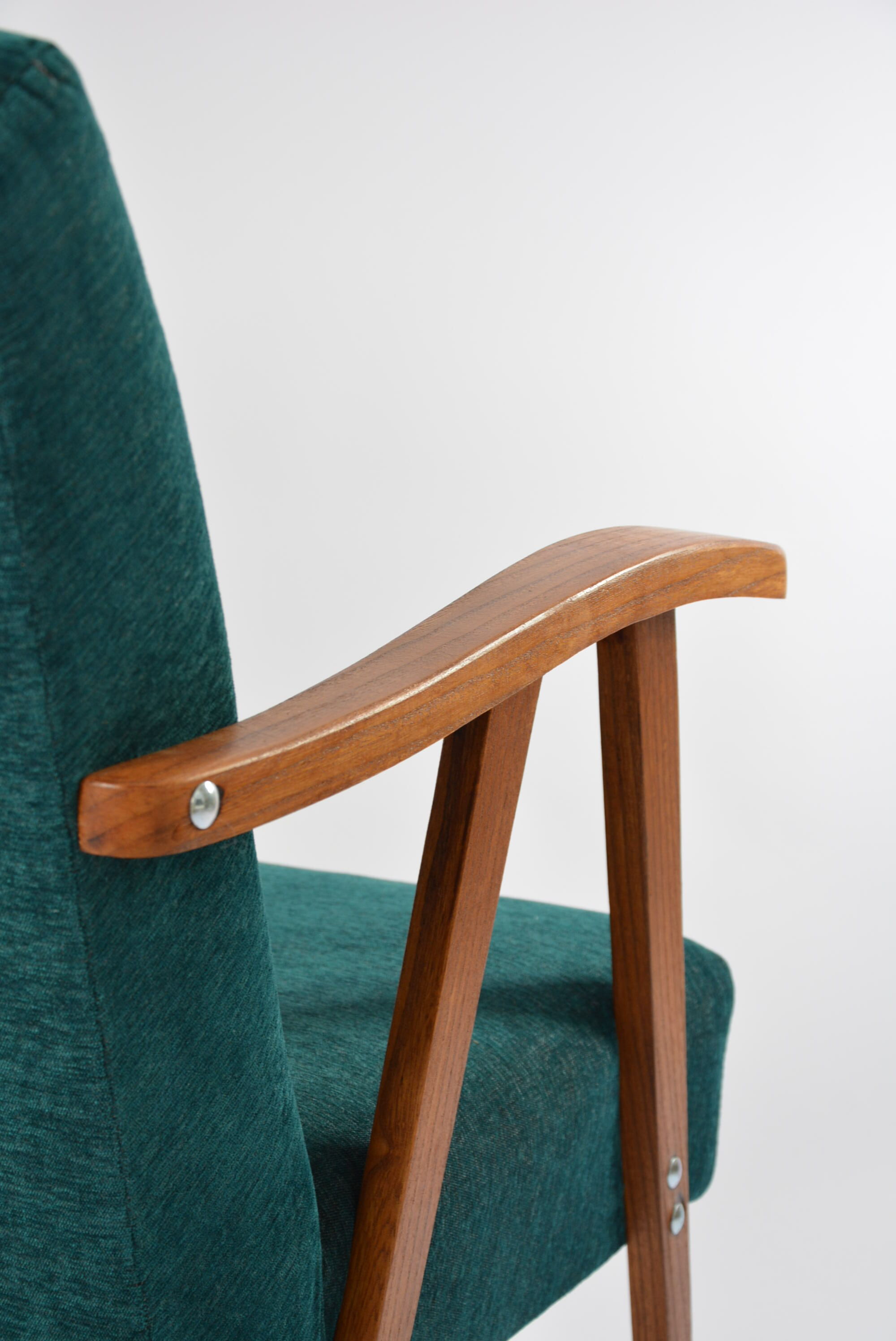 Green curved armchair