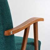 Green curved armchair