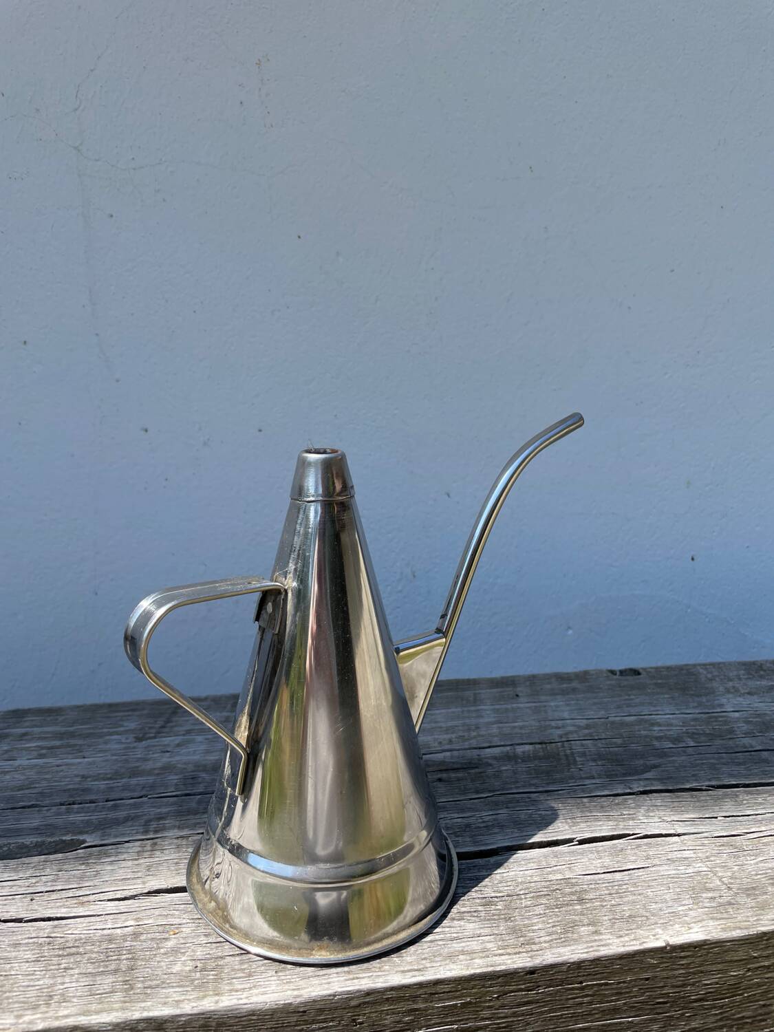 Small stainless steel watering can