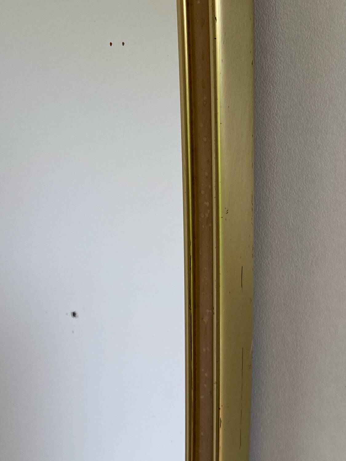 Vintage brass mirror in rear-view mirror shape