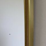 Vintage brass mirror in rear-view mirror shape
