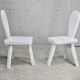 Pair of tripod chairs, gouged seats. Brutalist, circa 1960. Painted wood.