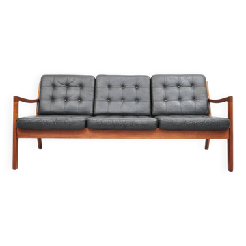 Senator sofa with black leather cushions by Ole Wascher for France and Son