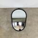 Oval mirror from the 1950s, wrought iron and brass.