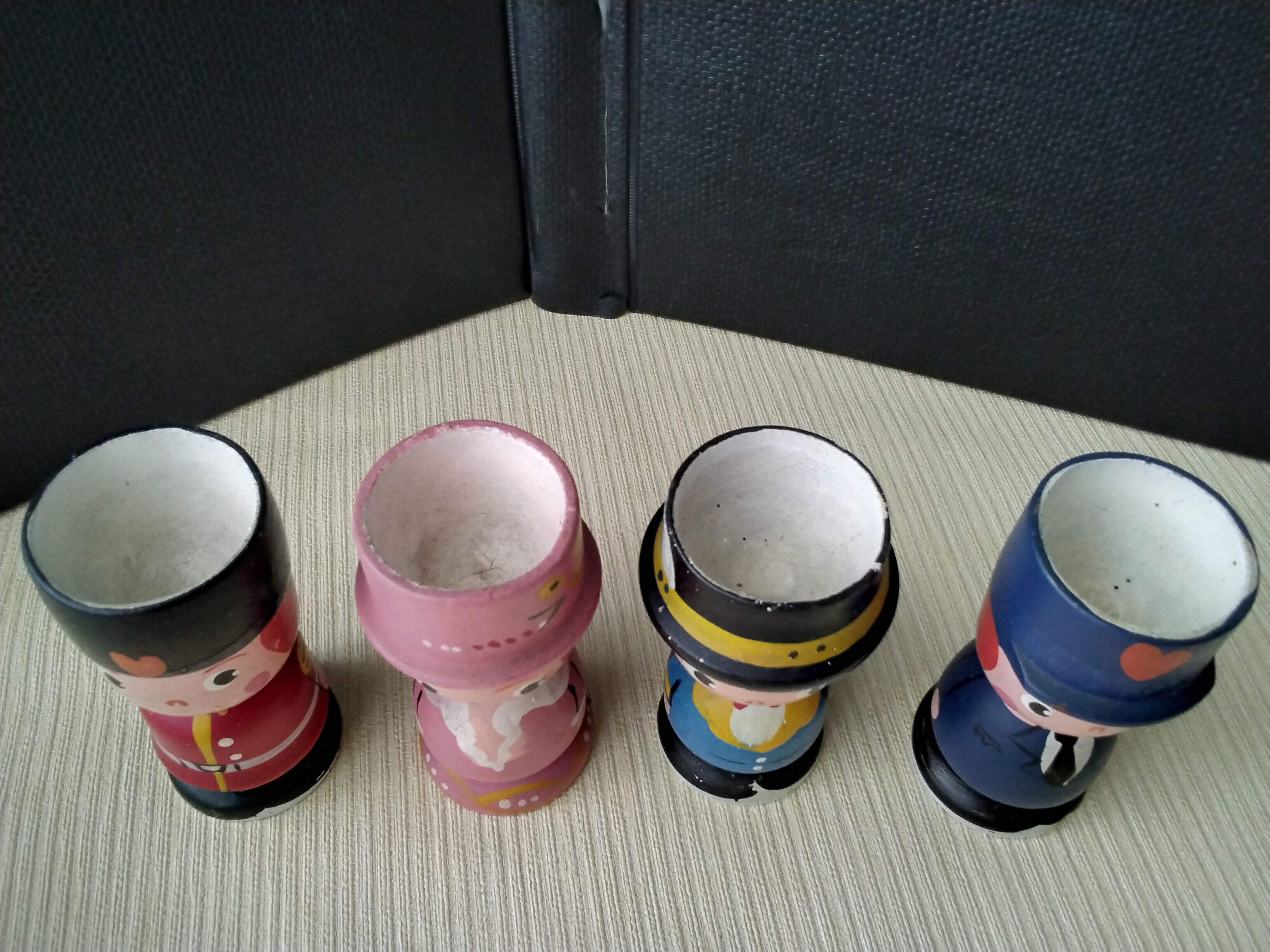 Set of 4 painted wooden characters eggcups