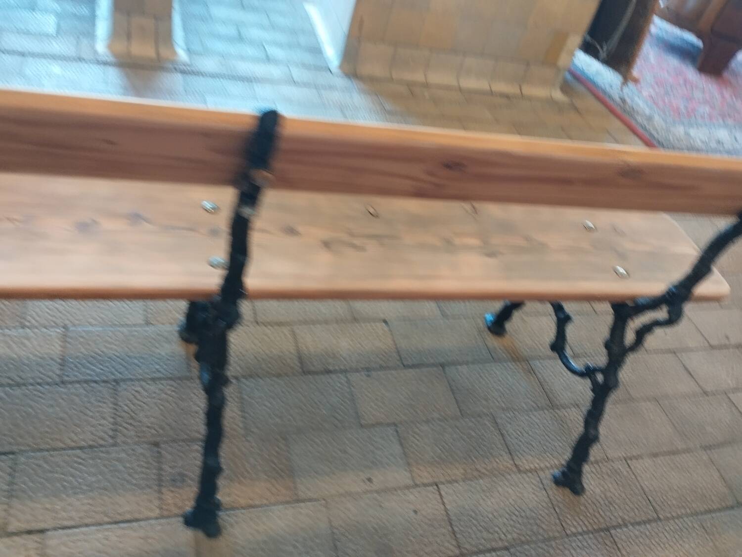 Antique garden bench with cast iron legs