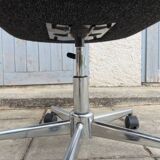 Black mottled fabric and chrome swivel armchair, 1