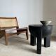 Black mango wood tripod side table with a semi-spherical top, height: 45 cm, diameter: 44 cm.