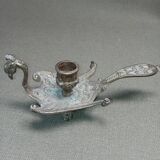 Chiselled brass candlestick in the shape of a peacock.