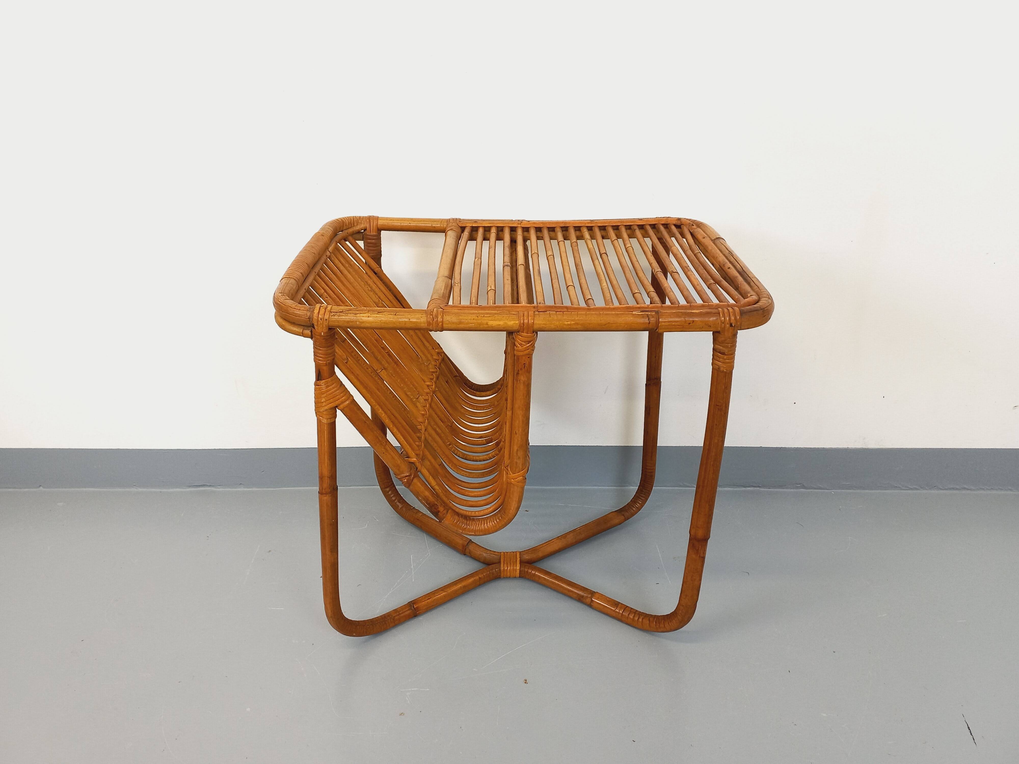 Side table / coffee table with vintage 1960s rattan magazine rack.