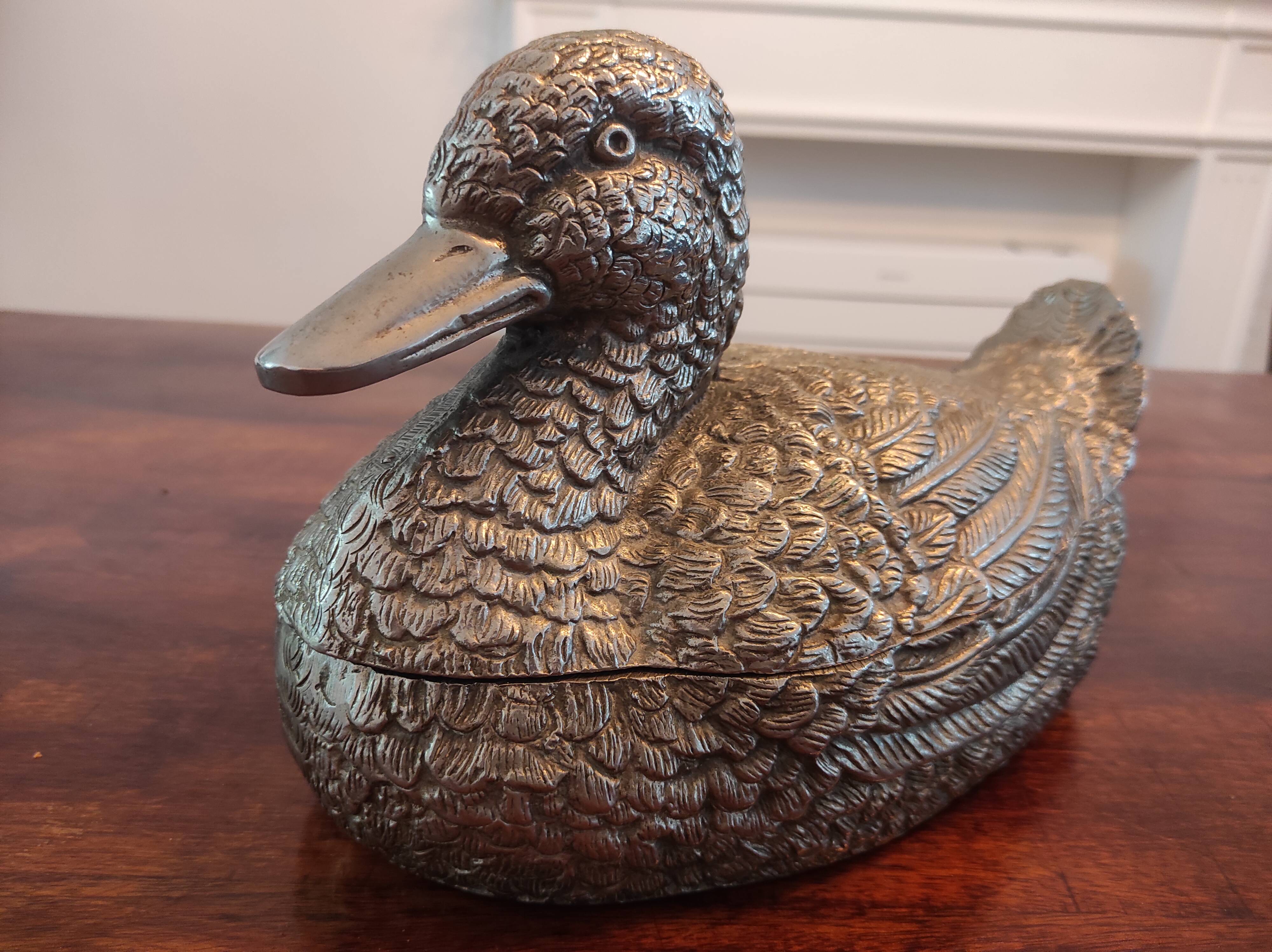 Large silver metal duck