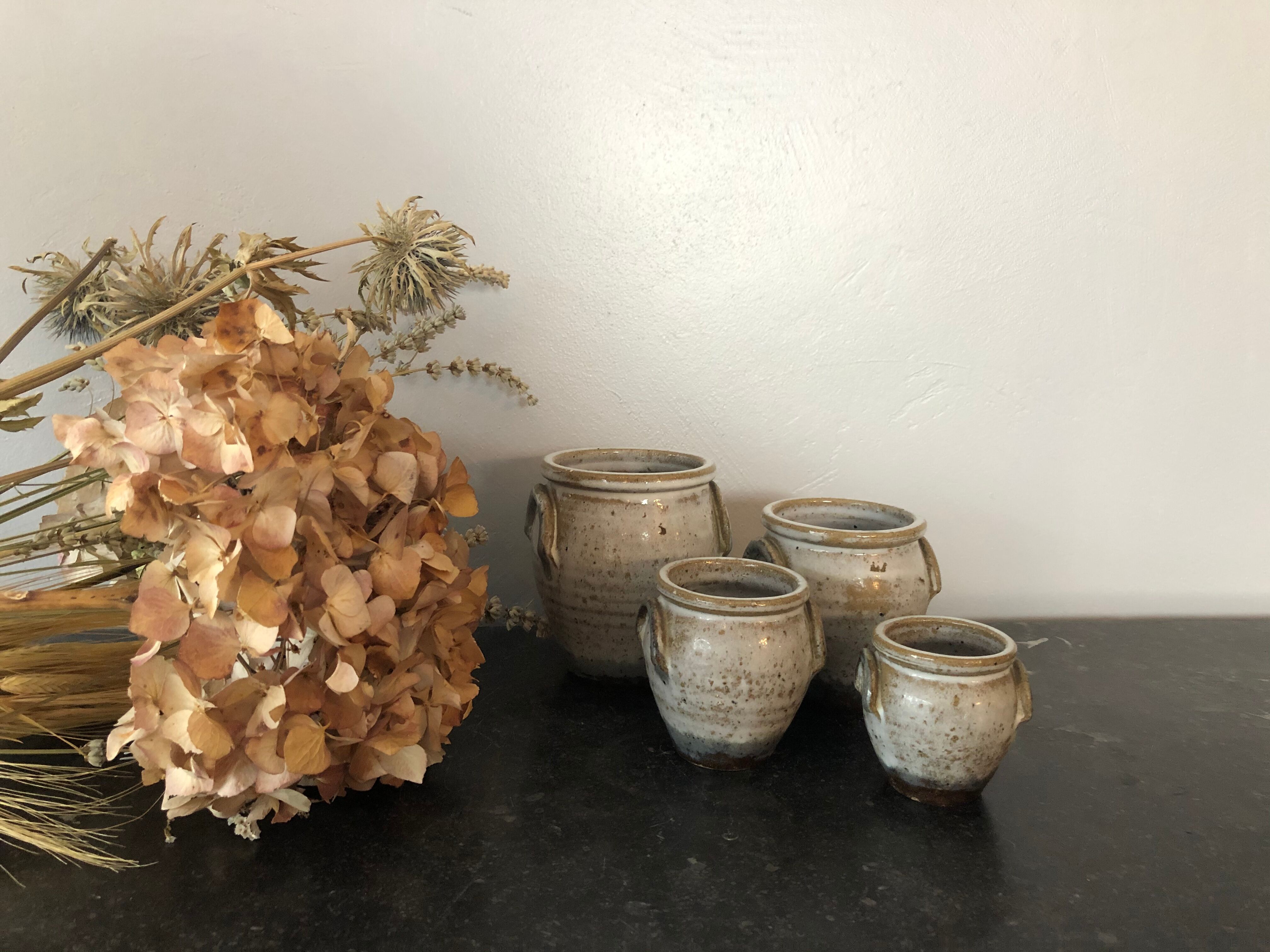 Set of 4 enamelled sandstone pots
