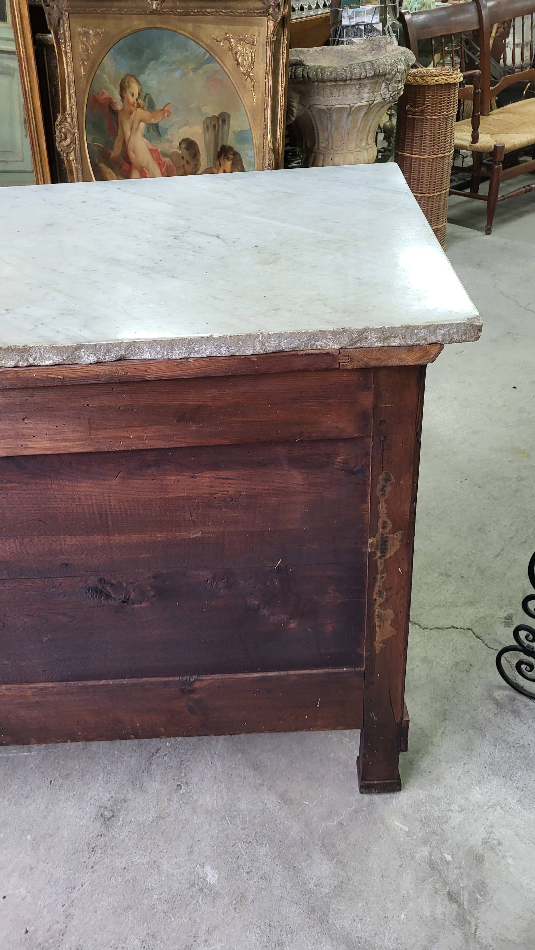 Empire commode in walnut with white marble top from the 19th century