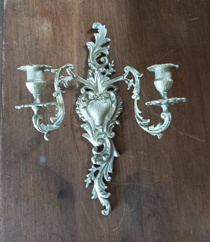 Cast iron wall candle holder with patinated gold metal