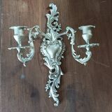 Cast iron wall candle holder with patinated gold metal