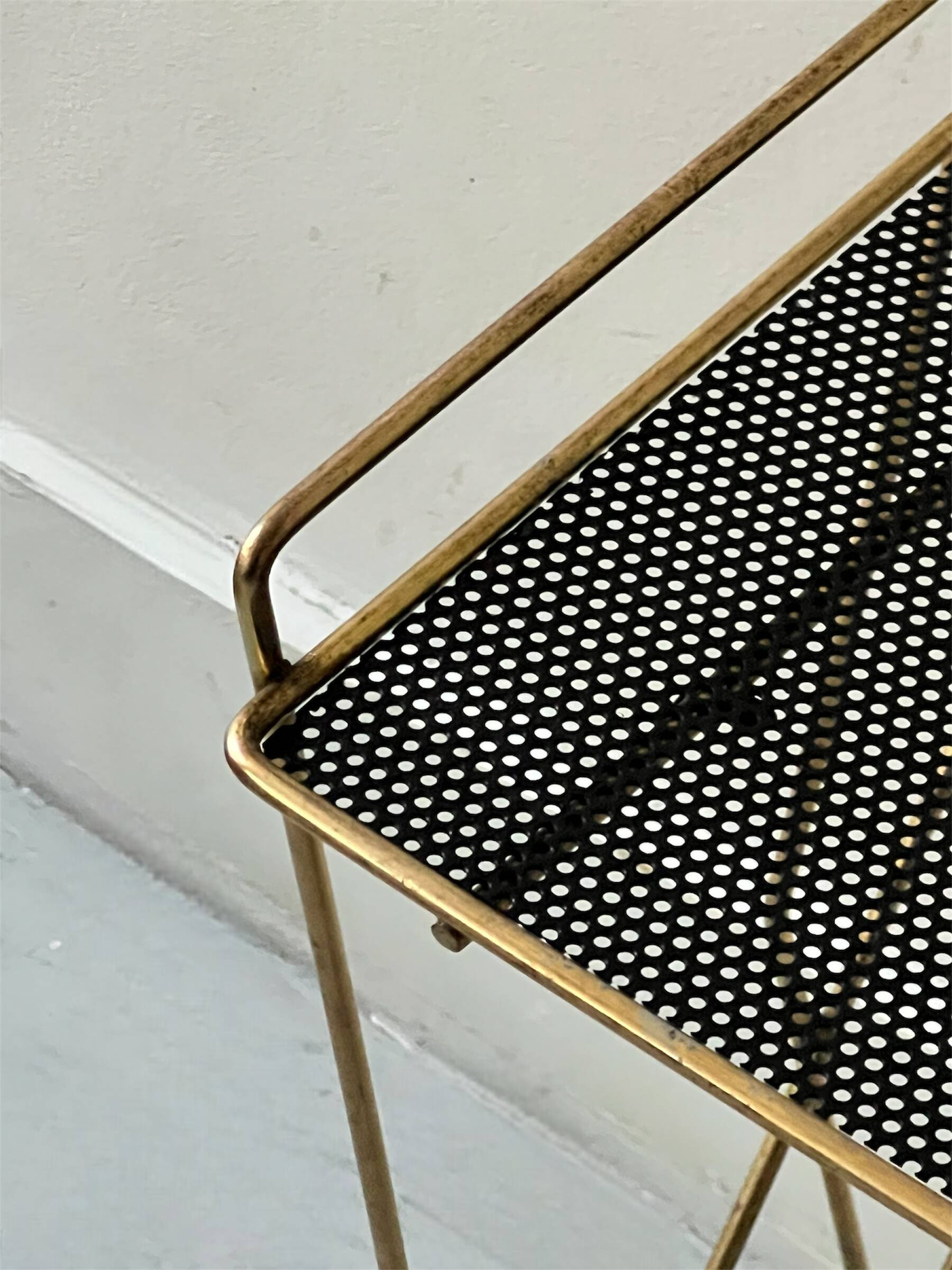 Side table - perforated metal magazine rack, designed by Matégot