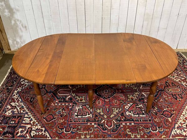 Table ronde en merisier 6 pieds des style Louis Philippe avec 2 allonges