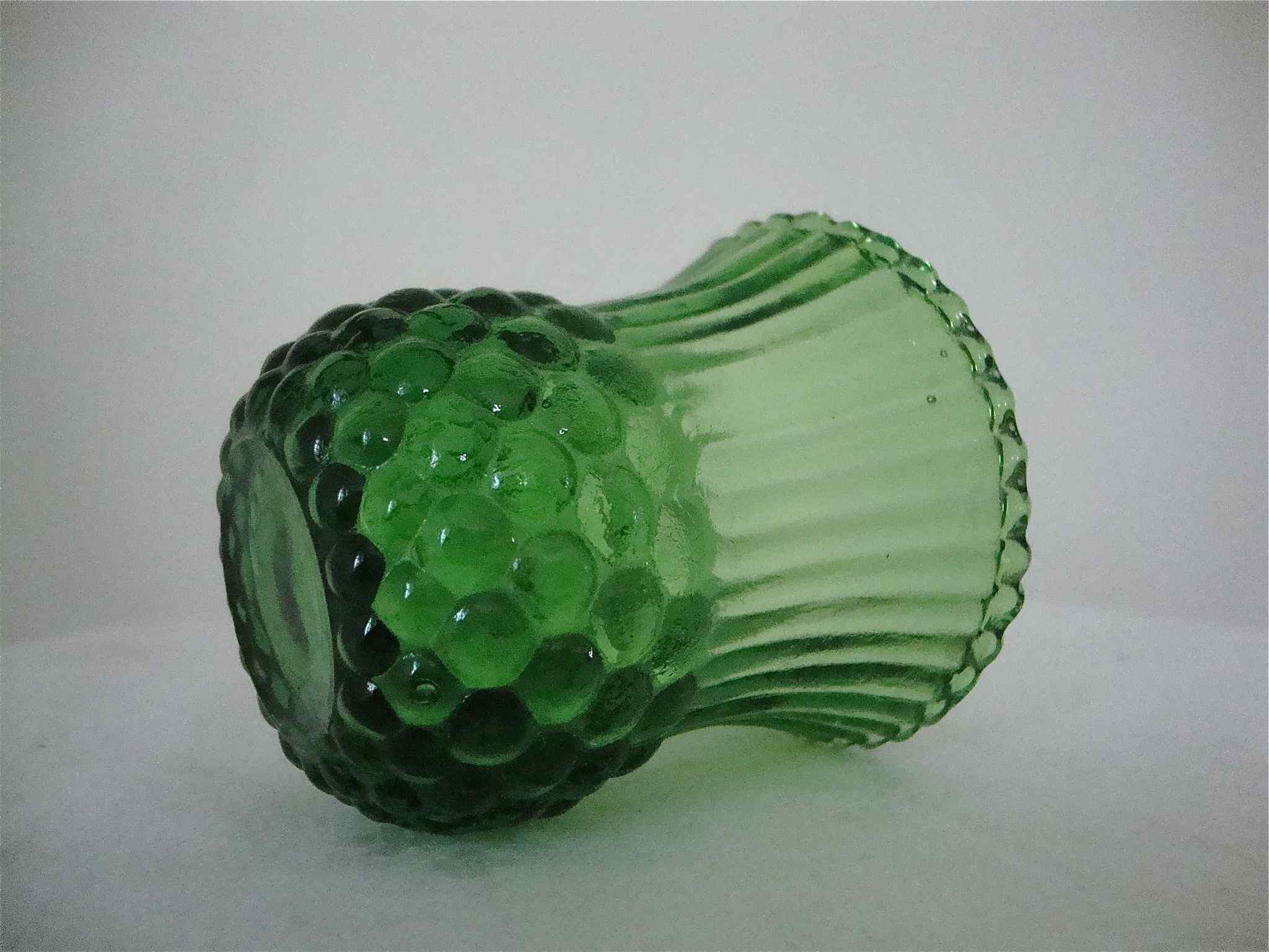 Very small green vase bottle