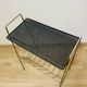 Perforated metal magazine rack