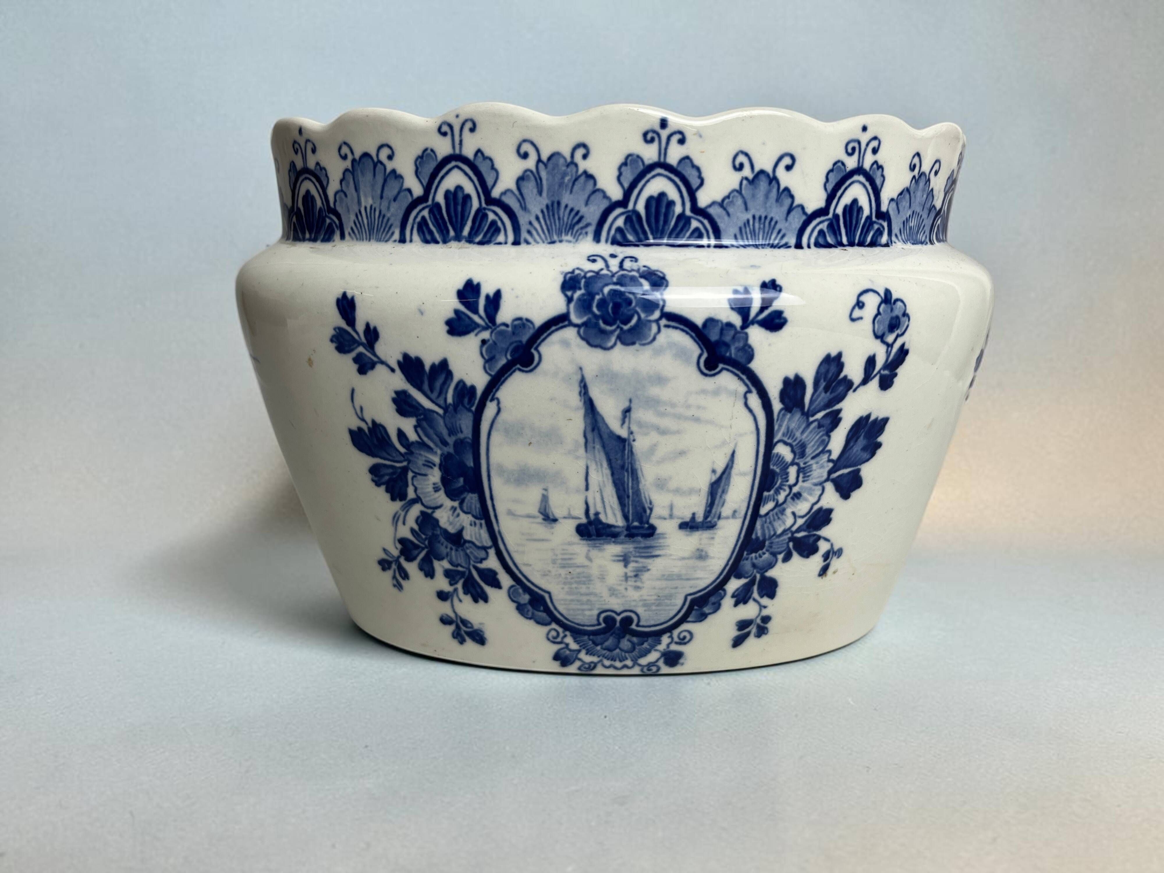 Delft, decorative pot planter with boat and windmill design from the early 20th century.