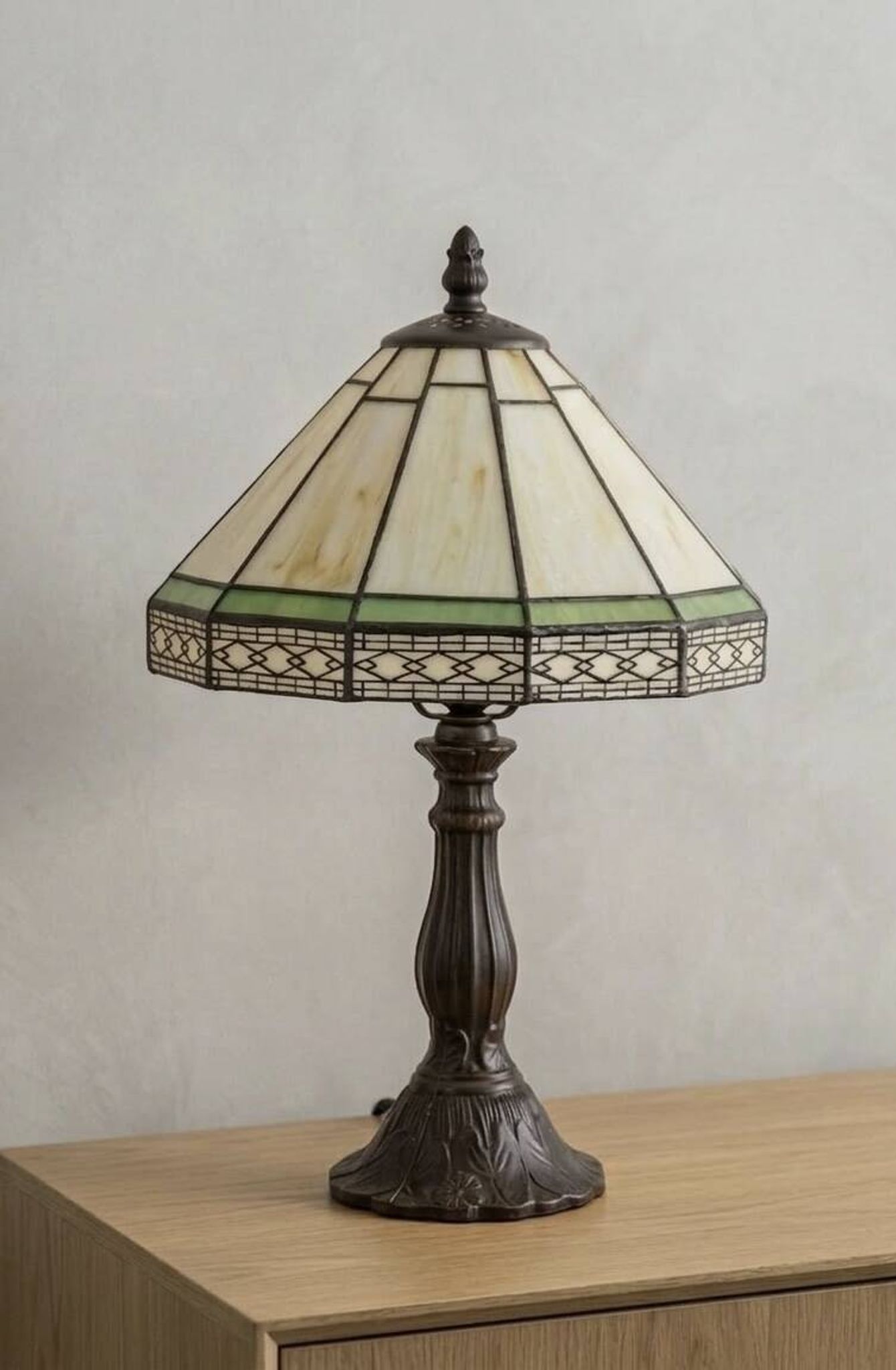 Tiffany-style stained glass lamp in green and amber white with vintage inspiration.