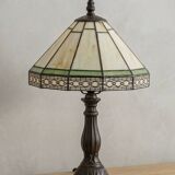 Tiffany-style stained glass lamp in green and amber white with vintage inspiration.