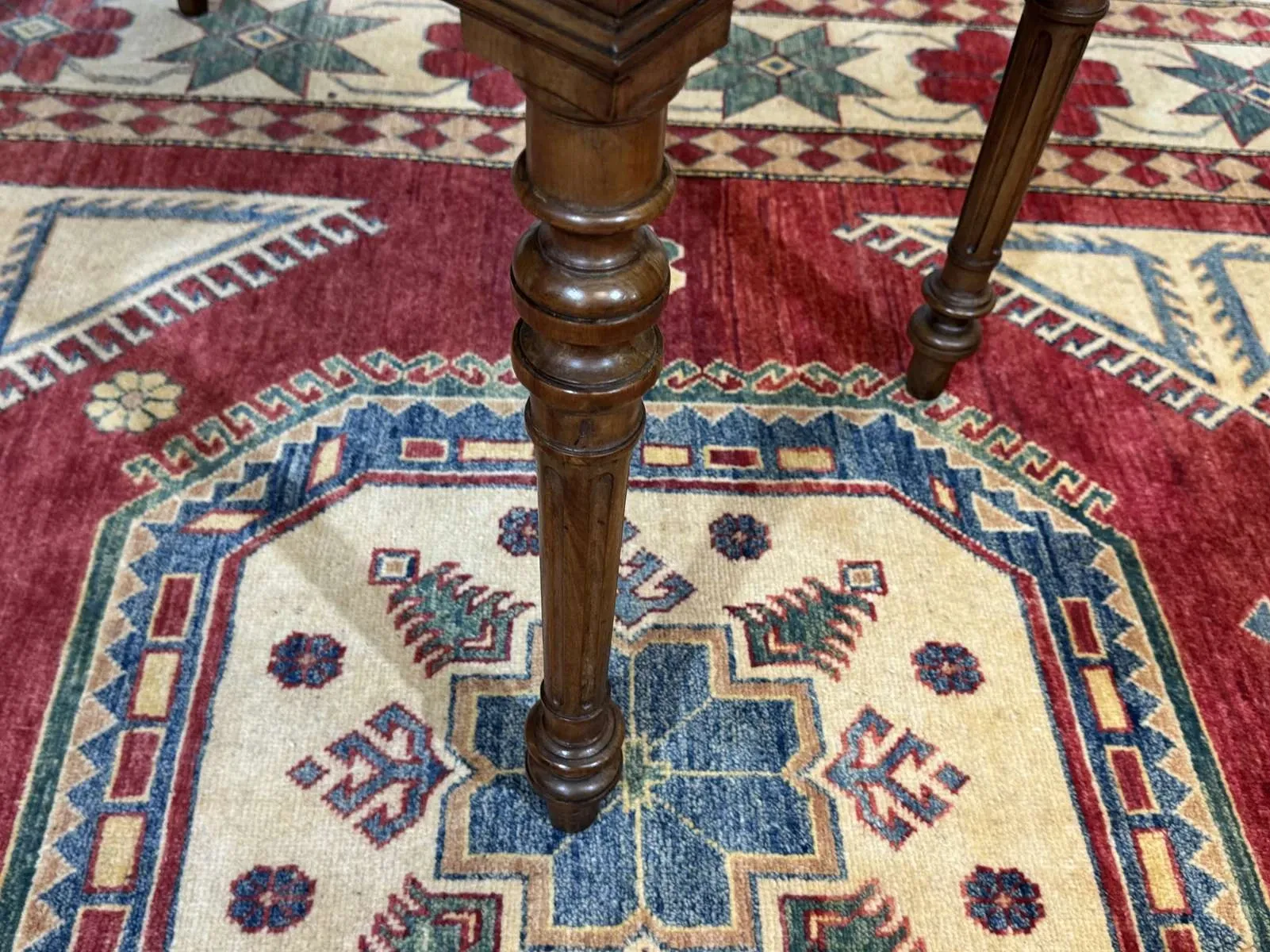Louis XVI style desk from the late 19th century in walnut with a leather top.