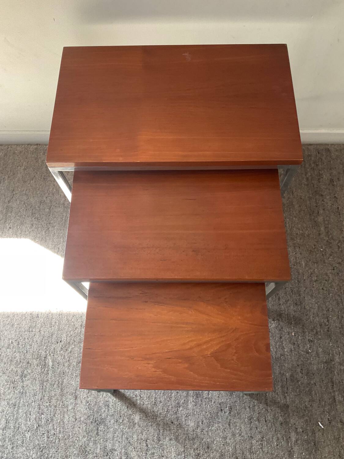 Trio of teak and chrome metal nesting tables from the 60s-70s