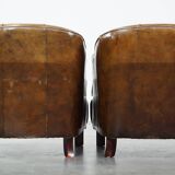 Set of 2 sturdy design armchairs made of cowhide with a beautiful deep color