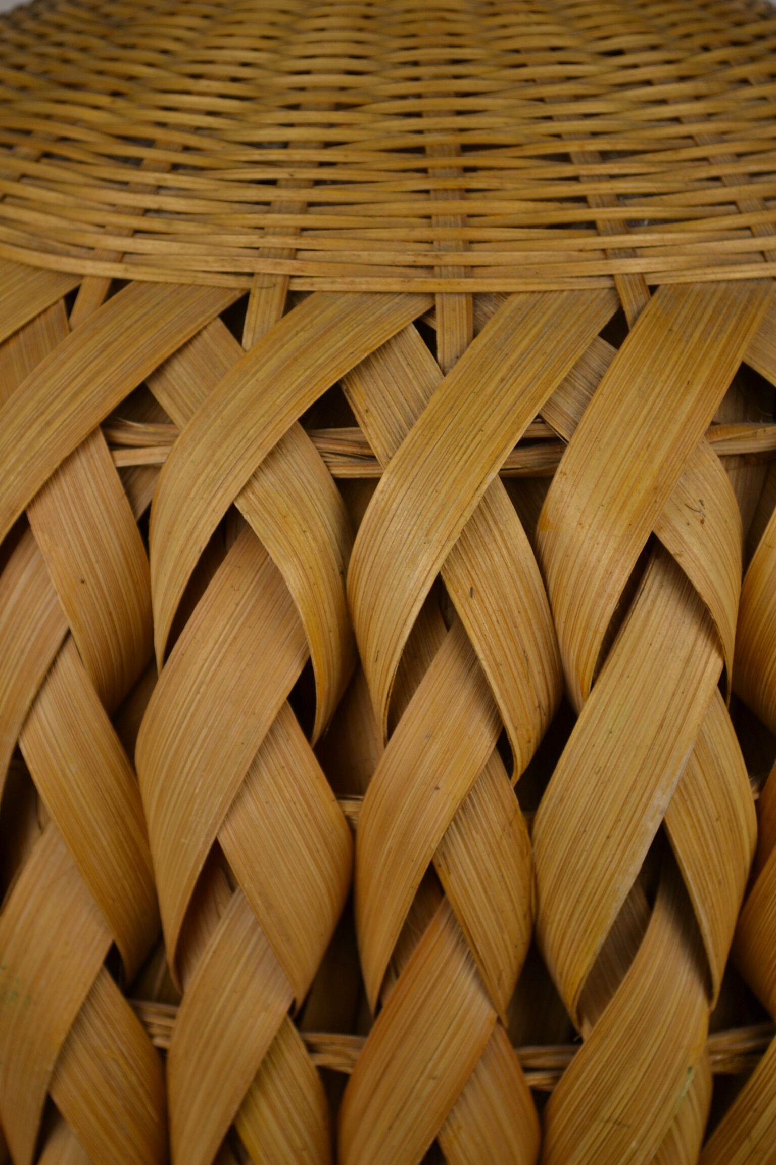 Rattan vase and braided bamboo leaves