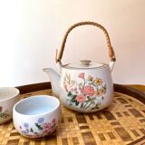 Vintage teapot in stoneware handle in rattan