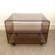 Coffee table / serving table in smoked plexiglass by Michel Dumas