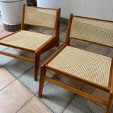Pair of teak and canning armchairs