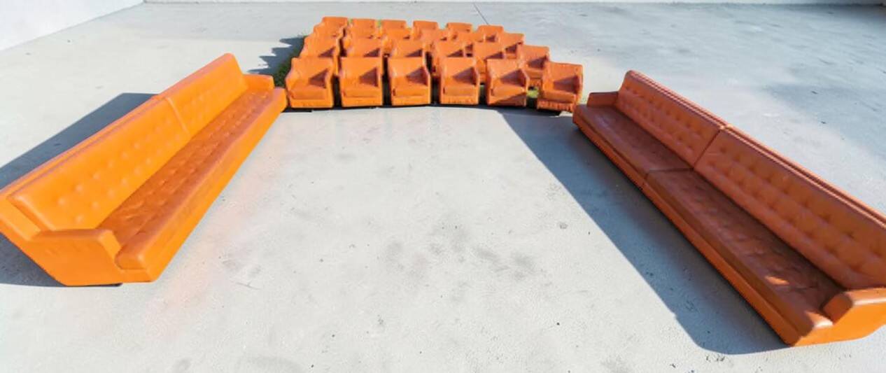 14 armchairs and 4 vintage orange leather benches