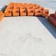 14 armchairs and 4 vintage orange leather benches
