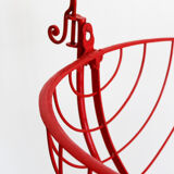 Baby cradle in red wrought iron