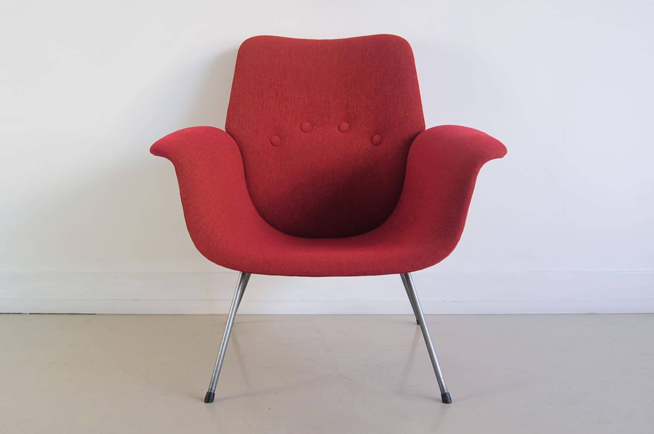 Red armchair with metal legs
