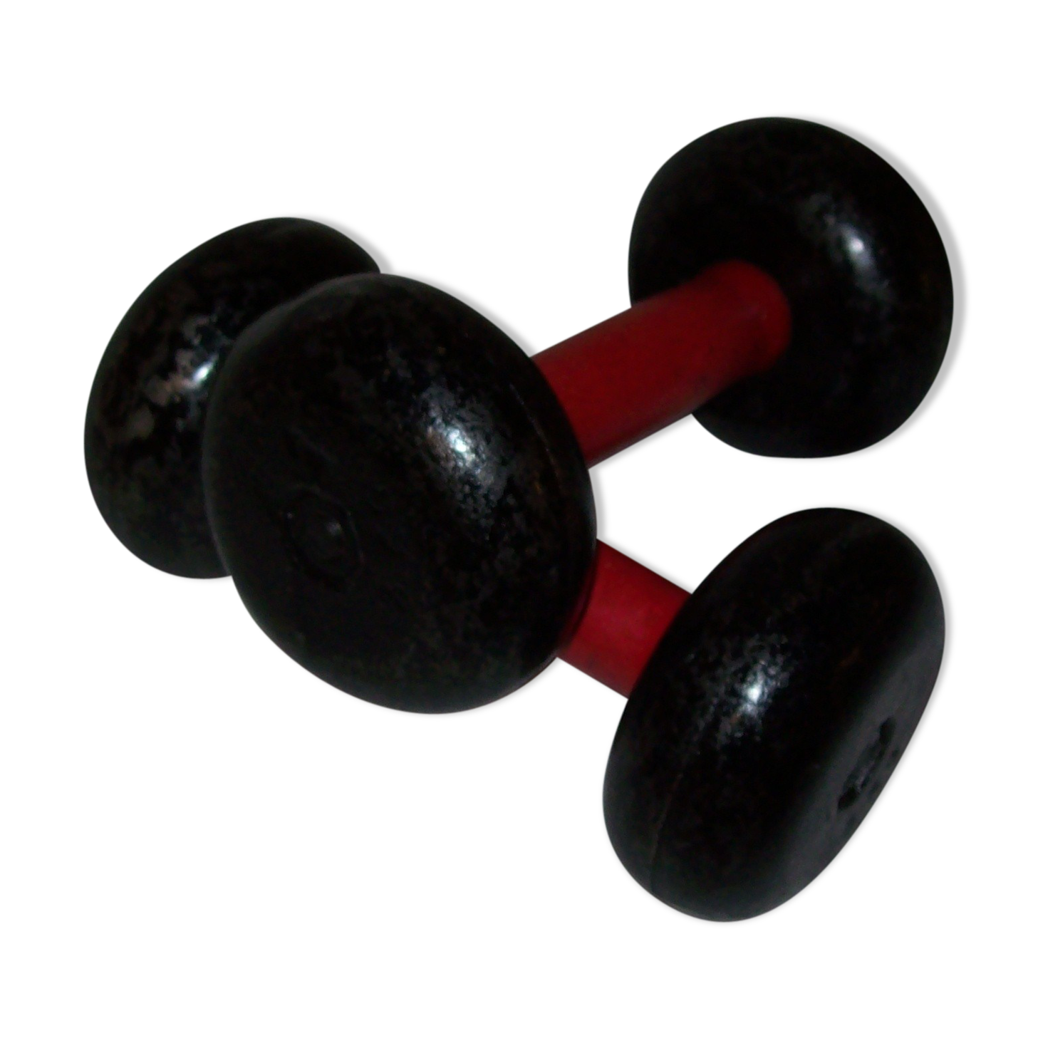 Red wooden and cast-iron dumbbells