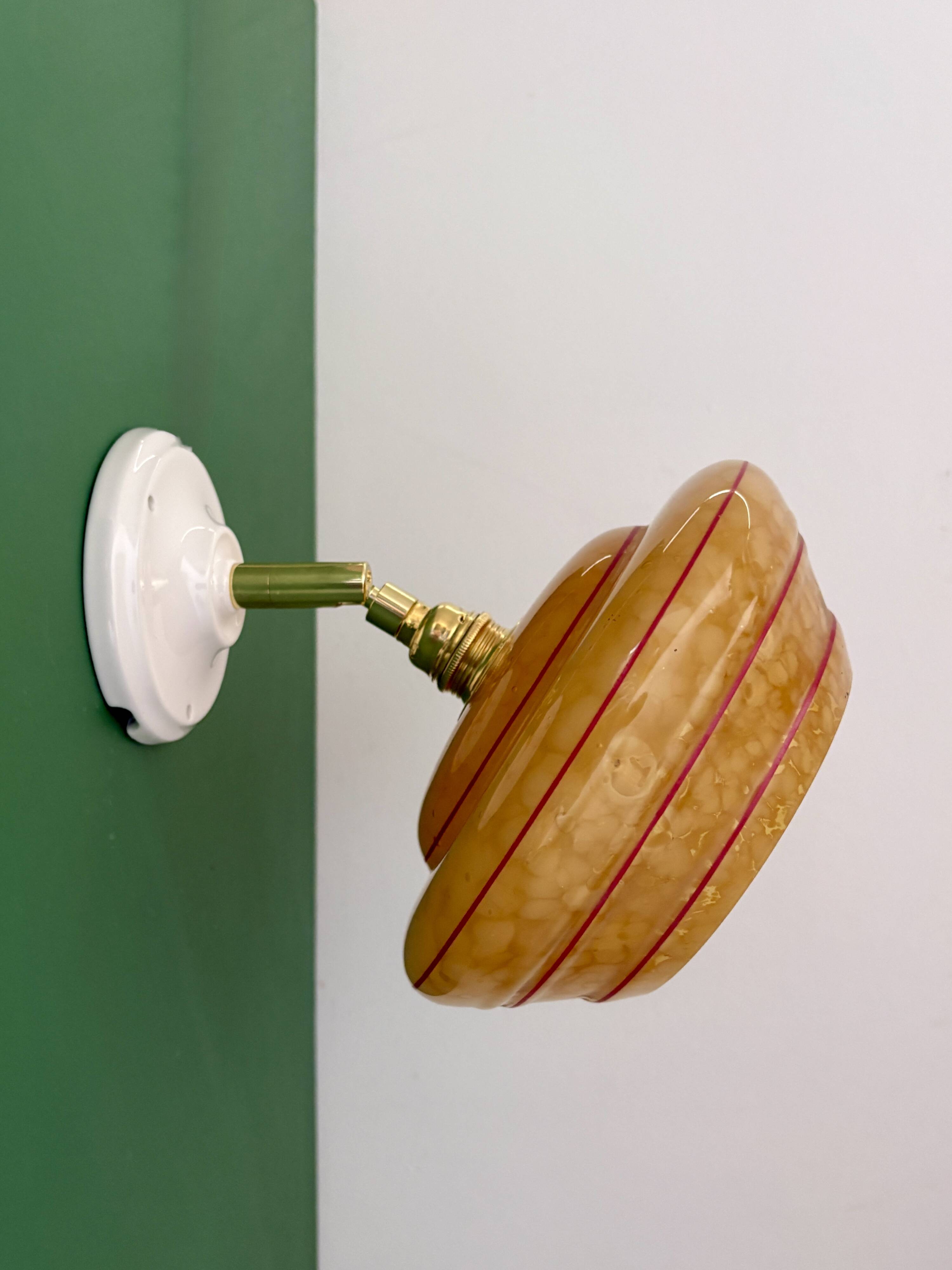 Vintage wall lamp with yellow clichy glass shade and red trim