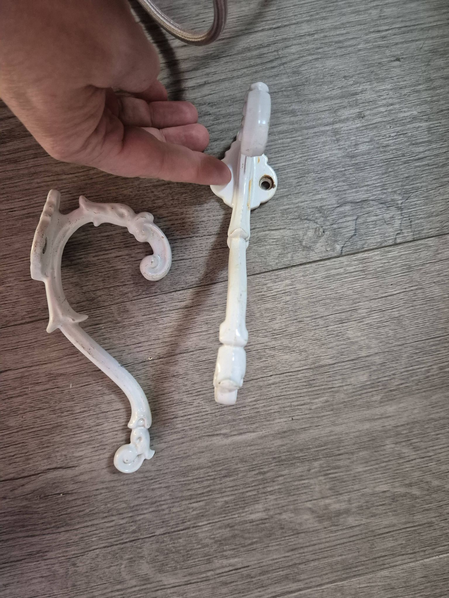 set of 2 vintage white cast iron hooks, small paint chips from the year