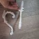 set of 2 vintage white cast iron hooks, small paint chips from the year