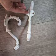 set of 2 vintage white cast iron hooks, small paint chips from the year