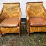 2 colonial armchairs in wood, rattan and leather, 1950s