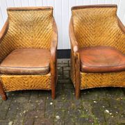 2 colonial armchairs in wood, rattan and leather, 1950s