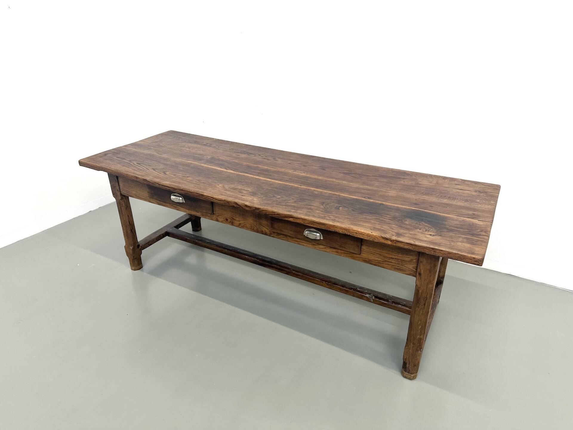 Authentic French farmhouse table from 1890 in solid oak with two drawers.
