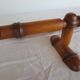 Wall-mounted canopy bed, in bamboo style wood.