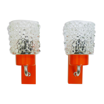 Pair of vintage space age design wall sconces in orange metal and diamond glass. Year 70