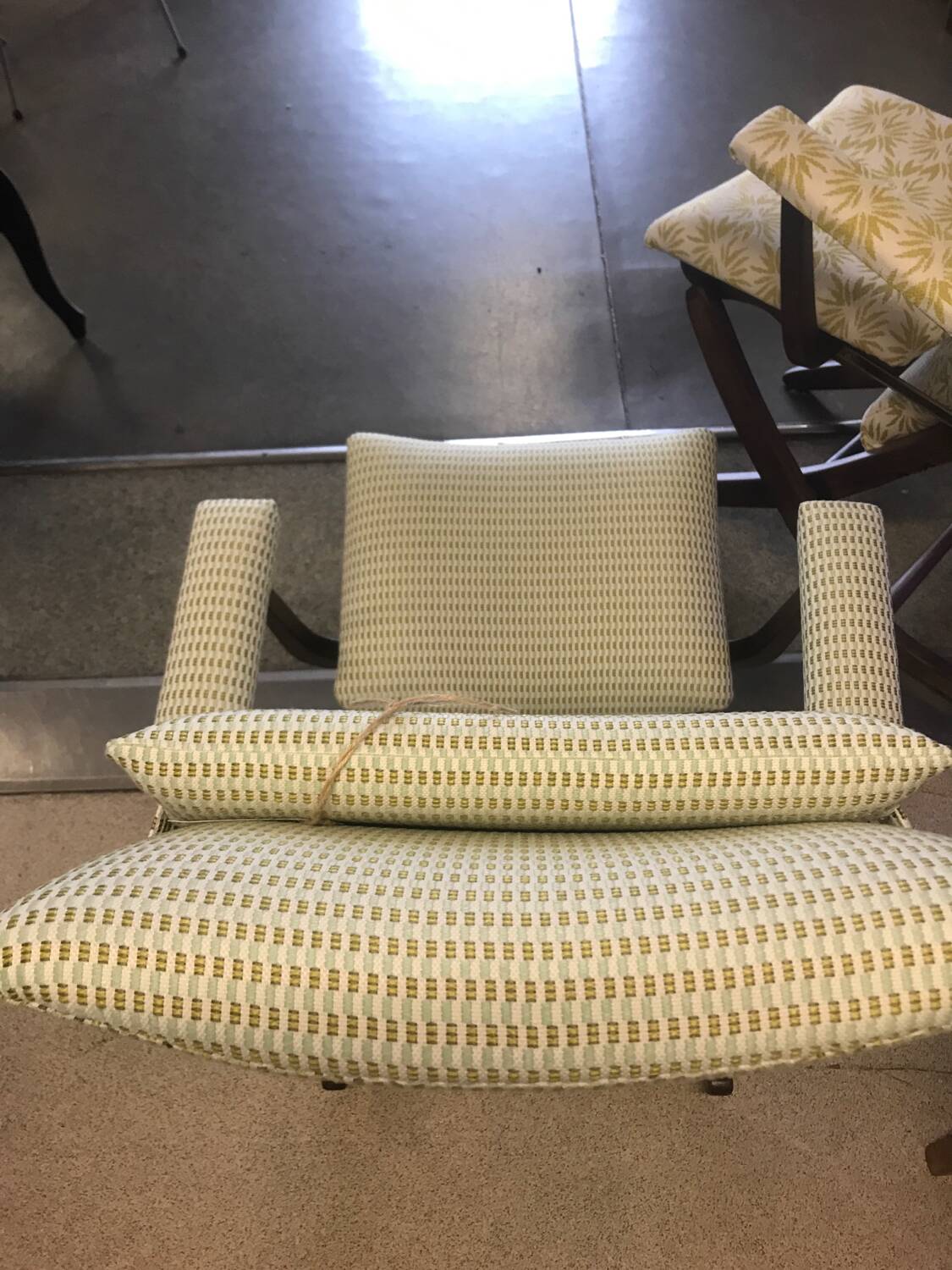 Rocking lounge chair made of fabric suitable for outdoor use.
