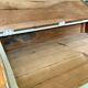 Antique wooden sloped desk, with a drop-down front and turned legs.